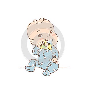 Little baby boy in blue pajamas sit, hold teething ring