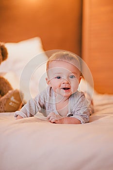 A little baby boy in a cosy room