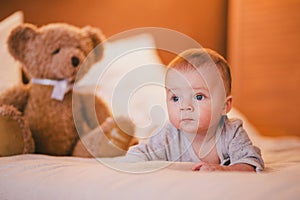 A little baby boy in a cosy room