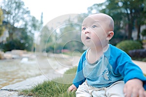 Little baby boy on the grass