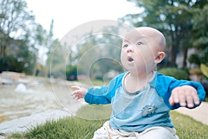 Little baby boy on the grass