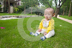 Little baby boy on the grass