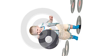 Little baby boy holding a vinyl disk