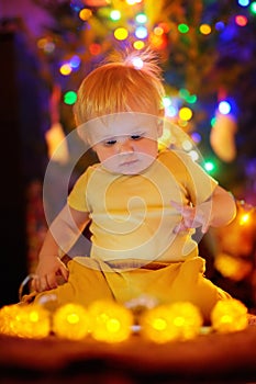 Little baby boy playing with illuminated toys