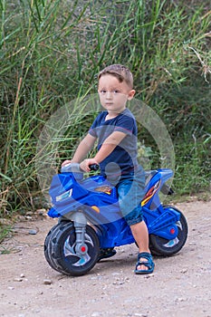 Little baby boy riding motobike