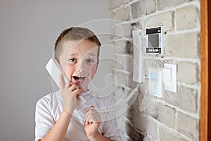 Little baby boy talking on intercom