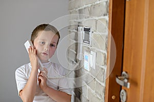 Little baby boy talking on intercom