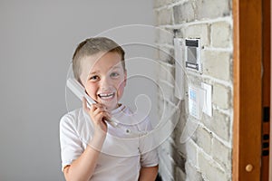 Little baby boy talking on intercom