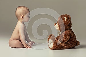 Little baby boy with teddy bear.