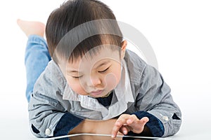 Little baby boy using tablet