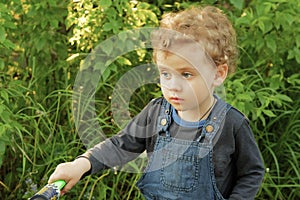 Little baby boy wearing jeans outdoor