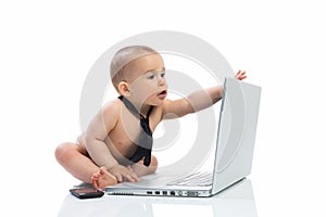 Little baby businessman using computer