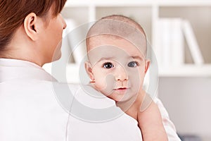 Little baby child with doctor pediatrician