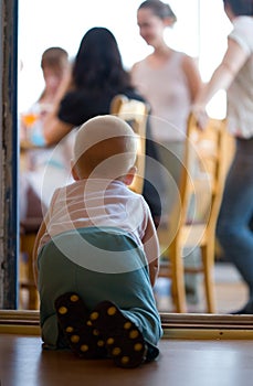 Little baby crawling to parents