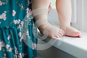 Little baby feet and woman