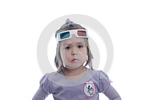 Little baby girl in 3D anaglyph cinema glasses for stereo image system with polarization. 3D goggles with red and blue eyes