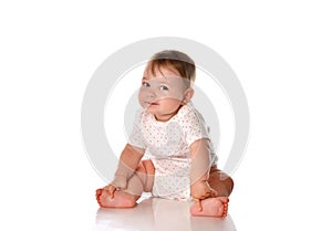 Little baby girl child on floor studio portrait