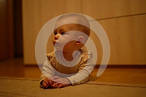 Little baby girl crawling on the floor