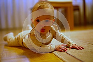 Little baby girl crawling on the floor