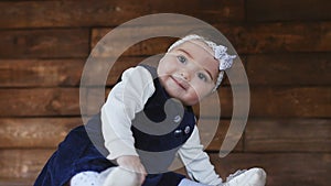 Little baby girl playing with plush toys