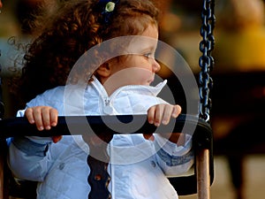 Little baby girl on see saw