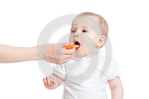 Little baby girl spoon feeding