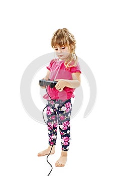 Little baby girl using video game controller