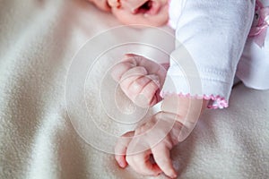 Little baby holding mother`s hand