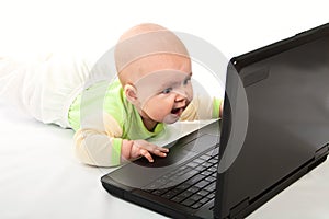 Little baby with laptop.