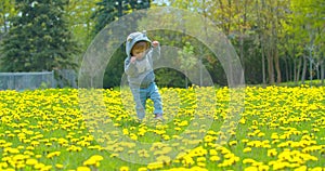 Little baby learns to walk. First steps.