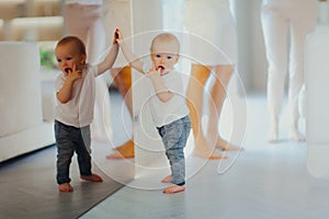 Little baby learns to walk at home