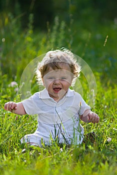 Little baby in the midle of green nature photo