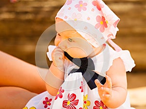 Little baby playing on beach during summertime