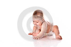 Little baby playing on floor over white background