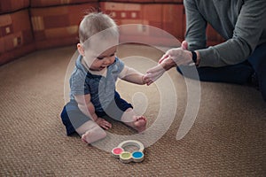 Little baby playing on living room floor