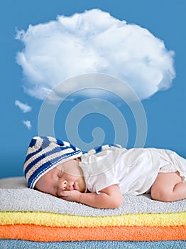 Little baby sleeping with a dreaming balloon cloud