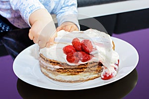 Little baby smash birthday cake with a spoon, happy birthday.