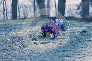 Little baby toddler fall down during exploring outside world