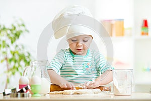 Little baker kid girl in chef hat