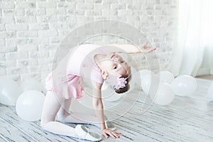 Little ballerina in a studio