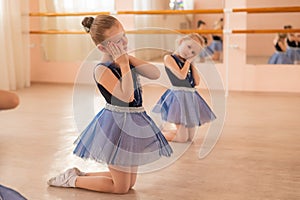 Little ballerinas perform at a dance school.