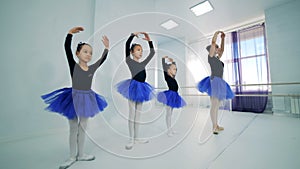 Little ballet dancers during a training, close up.