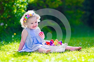 Little beautiful girl on Easter egg hunt