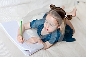 Little beautiful girl painting.