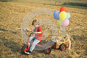 Little bikers with retro cycle. Boy ride bike on country track road. Concept for safety and child development. Concept