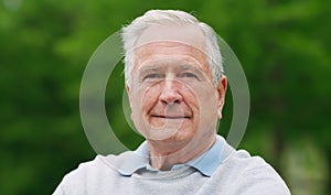 A little bit older and a whole lot wiser. Portrait of a confident senior man enjoying a day in the park.