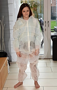 A little bit too big, girl tries protective suit