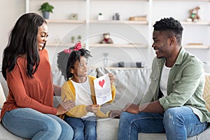 Little Black Daughter Making Surprise For Her Dad At Home