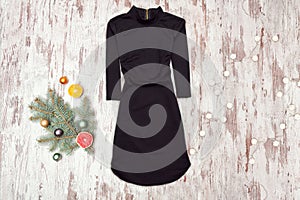 Little black dress with sleeves and spruce branch