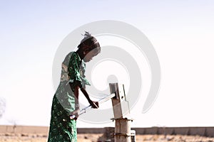 Little Black Women Carrying Pure Water with major difficulties